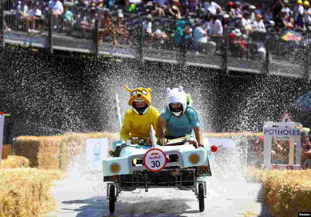 Participants race during the Red Bull Box Cart Race challenges in Bo Kaap, one of the iconic neighbourhoods in Cape Town, South Africa, November 6, 2022.