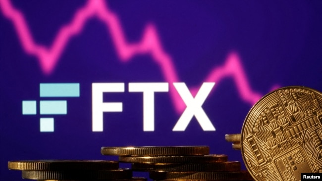 FILE - Representations of cryptocurrencies are seen in front of displayed FTX logo and decreasing stock graph in this illustration taken Nov.10, 2022