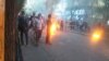 In a screengrab from UGC video posted on social media Nov. 4, 2022, protesters are seen setting fires during an anti-government rally in Tabriz, northwestern Iran. 