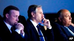 From left, White House national security adviser Jake Sullivan, Secretary of State Antony Blinken and Sameh Shoukry, Egypt's foreign minister and COP27 president, listen as President Joe Biden speaks at the COP27 U.N. Climate Summit, Nov. 11, 2022, at Sharm el-Sheikh, Egypt.