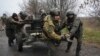 Ukrainian National Guard soldiers move an anti-aircraft gun after firing it at Russian positions in Ukraine's Kharkiv region, Nov. 11, 2022.
