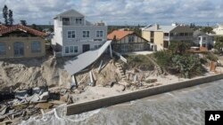 FILE - Damaged beachfront properties in Wilbur-by-the-Sea, Fla., on Nov. 11, 2022, after Hurricane Nicole passed through.
