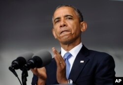 President Barack Obama applauds those who serve in Iraq and Afghanistan as he deliverers the commencement address to the U.S. Military Academy at West Point's Class of 2014, in West Point, N.Y., May 28, 2014.