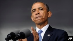 President Barack Obama applauds those who serve in Iraq and Afghanistan as he deliverers the commencement address to the U.S. Military Academy at West Point's Class of 2014, in West Point, N.Y., May 28, 2014. 