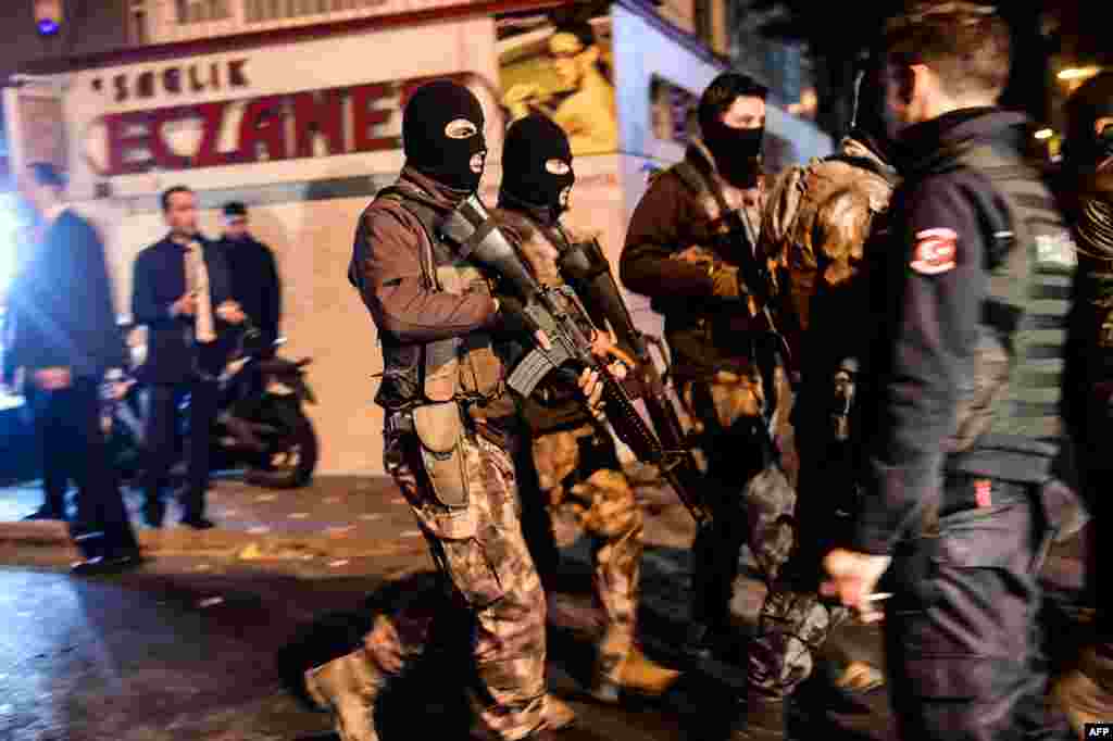 Turkish special force police officers patrol streets after a car bomb exploded near the stadium of football club Besiktas in Istanbul Dec. 10, 2016, killing at least 38 people and wounding around 20 police officers.