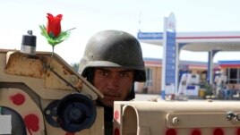 An Afghan army soldier stands guard on the outskirts of Mazar-e-Sharif, Afghanistan, Tuesday, Aug. 10, 2021. (AP Photo/Mirwais Bezhan)