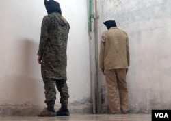 Islamic State fighters imprisoned by Kurdish YPG authorities in the northeastern town of Al-Malikiyah, Syria, March 23, 2015. (Zana Omer/VOA)