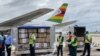 Health officials load 200,000 Sinopharm COVID-19 vaccine doses, donated by China, into a government truck at the Robert Gabriel Mugabe International Airport in Harare, Feb. 15, 2021. (Columbus Mavhunga/VOA)