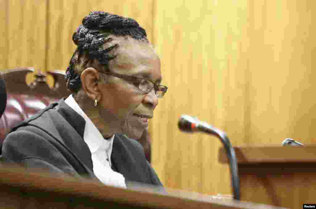 Judge Thokozile Masipa delivers judgment during the appeal by prosecutors against the verdict and sentence of Oscar Pistorius in the North Gauteng High Court in Pretoria, Dec. 10, 2014.