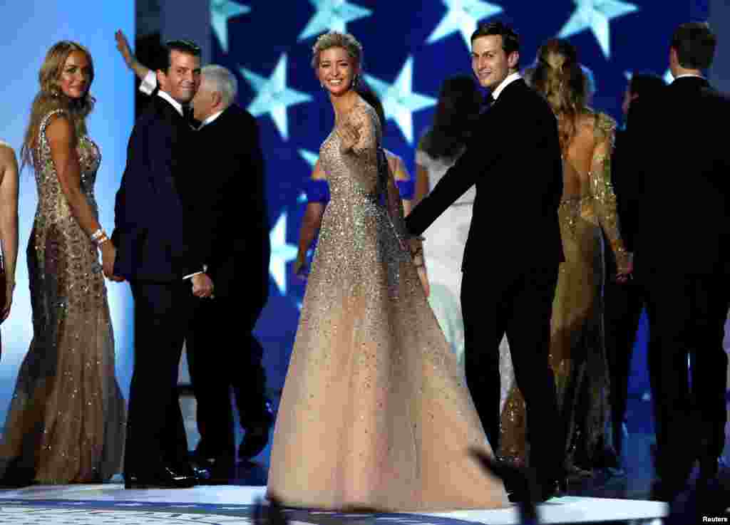 Ivanka Trump and her husband, Jared Kushner, look back as they leave the ball with her brother Donald Trump Jr and his wife, Vanessa, at the Inauguration Freedom Ball in Washington, Jan. 20, 2017.
