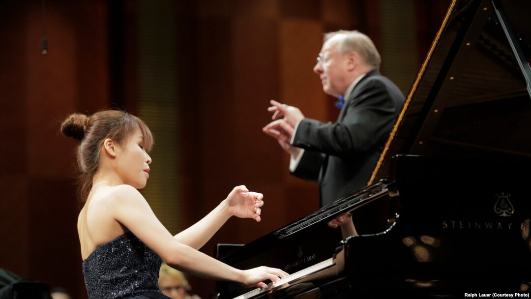 Rachel Cheung of Hong Kong performs with conductor Nicholas McGegan and the Fort Worth Symphony Orchestra on Sunday in the Semifinal Round at the 15th Van Cliburn International Piano Competition.