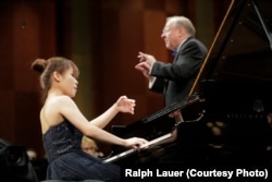 Rachel Cheung of Hong Kong performs with conductor Nicholas McGegan and the Fort Worth Symphony Orchestra on Sunday in the Semifinal Round at the 15th Van Cliburn International Piano Competition.