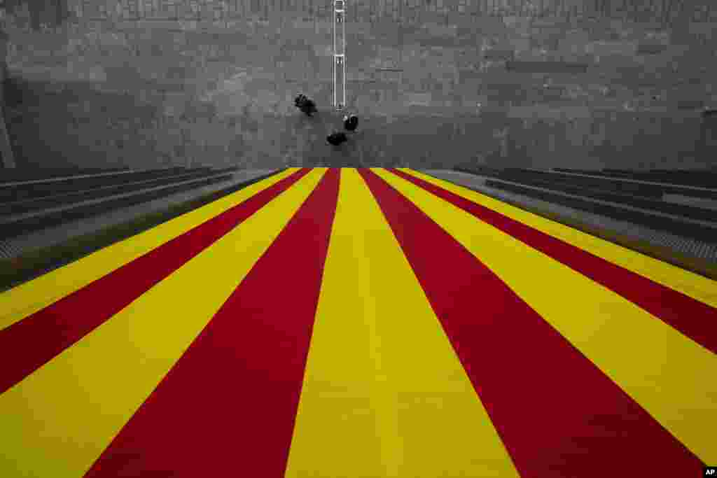 A Catalan flag hangs from a Catalan government building in Girona, Spain.