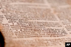 The word "breeches" is visible as the last word in verse 7 of chapter 3 in Genesis in the theft recovered Bible shown during a news conference, April 25, 2019, in Pittsburgh. The word gives the 1615 Breeches Edition Bible in the 1990's its name.