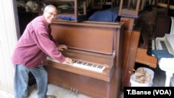Piano tuner Dean Petrich of Freeland, Washington, gives away pianos for price of delivery to winnow his stash of more than 80 cast-off pianos.