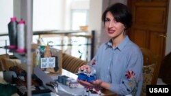 Guko, a shoemaker who receives entrepreneurship support via YES-Georgia.