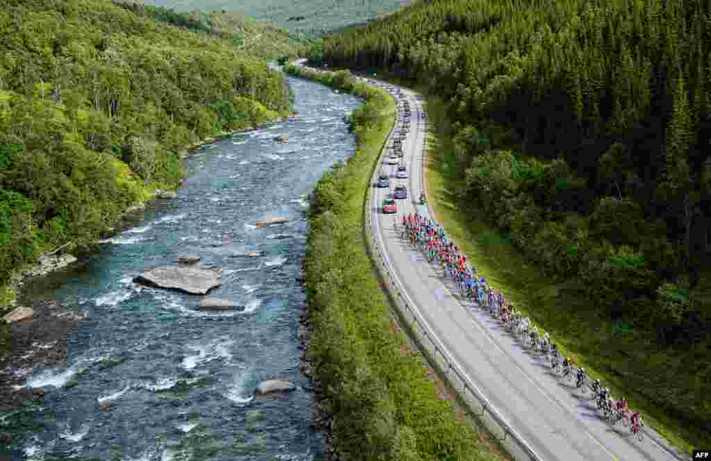 The peloton rides during the 184,5 km second stage of the Arctic Race of Norway between Sjoevegan and Bardufoss Airport in Norway.