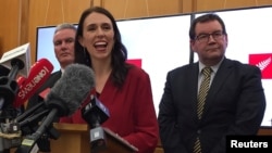 New Zealand Labour leader Jacinda Ardern smiles as she speaks to the press after leader of New Zealand First party Winston Peters announced his support for her party in Wellington, New Zealand, Oct. 19, 2017.