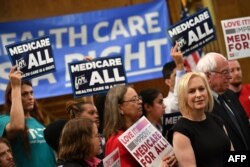 Democratic 2020 presidential hopefuls Sen. Kirsten Gillibrand (D-NY) and Bernie Sanders (I-VT) attend a Medicare For All event on Capitol Hill in Washington, April 10, 2019.