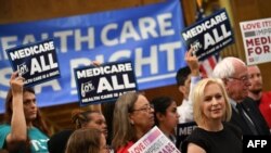 Democratic 2020 presidential hopefuls Sen. Kirsten Gillibrand (D-NY) and Bernie Sanders (I-VT) attend a Medicare For All event on Capitol Hill in Washington, April 10, 2019. 