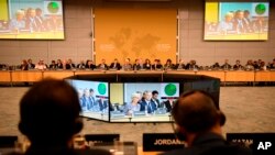FILE - Participants attend the "No Money for Terror" conference at the Organization for Economic Cooperation and Development in Paris, April 26, 2018. Ministers from more than 70 countries worked on ways to combat financing for the Islamic State.