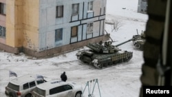 The Organization for Security and Cooperation in Europe (OSCE) cars and tanks are seen in the government-held industrial town of Avdiyivka, Ukraine, Feb. 1, 2017.