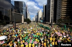 Demonstrators attend a protest against Brazil's President Dilma Rousseff, part of nationwide protests calling for her impeachment, at Paulista Avenue in Sao Paulo's financial centre, Brazil, Aug. 16, 2015.