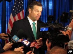 FILE - Kansas Secretary of State Kris Kobach speaks to supporters, June 8, 2017, at an events center in Lenexa, Kansas.