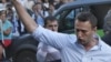FILE - In this file photo taken on Friday, Aug. 17, 2012, Russian protest leader Alexei Navalny gestures as he walks outside a court in Moscow, Russia. 