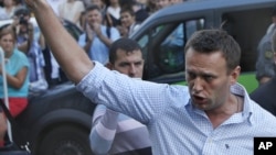 FILE - In this file photo taken on Friday, Aug. 17, 2012, Russian protest leader Alexei Navalny gestures as he walks outside a court in Moscow, Russia. 