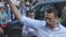 FILE - In this file photo taken on Friday, Aug. 17, 2012, Russian protest leader Alexei Navalny gestures as he walks outside a court in Moscow, Russia. 