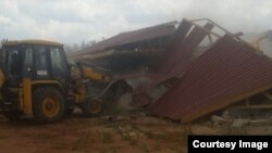 Harare City Council in action demolishing houses owned by some local people. (Photo: Courtesy - CHRA)