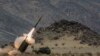 资料照片：在加州二十九棕榈村美国海军陆战队空地作战中心举行的一次演习期间，一支海军陆战队炮兵连发射HIMARS多管火箭炮。(2014年5月18日)
