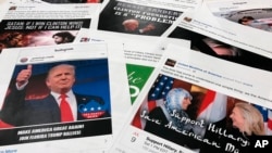 FILE - Some of the Facebook and Instagram ads linked to a Russian effort to disrupt the American political process and stir up tensions around divisive social issues, released by members of the U.S. House Intelligence committee, are photographed in Washington.