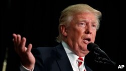 FILE - Then-presidential nominee Donald Trump speaks during a campaign rally at Windham High School, in Windham, New Hampshire, Aug. 6, 2016.