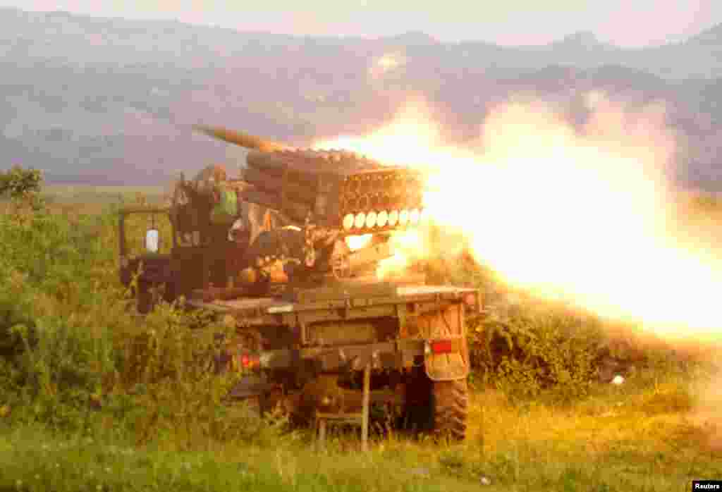 Rockets are fired from a Congolese army vehicle in the direction of M23 rebels in Kibumba, north of Goma, Oct. 27, 2013. 