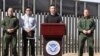 FILE - Customs and Border Protection Commissioner Kevin McAleenan, center, announced that the Trump administration will temporarily reassign several hundred border inspectors during a news conference at the border in El Paso, Texas, March 27, 2019. 