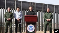 Customs and Border Protection Commissioner Kevin McAleenan (C) announced that the Trump administration will temporarily reassign several hundred border inspectors during a news conference at the border in El Paso, Texas, March 27, 2019.