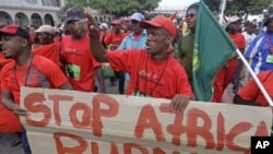 Protesters shout during a climate change rally outside the climate change summit held in the city of Durban, South Africa, December 2, 2011.