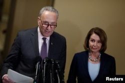 FILE - Senate Minority Leader Chuck Schumer and House Minority Leader Nancy Pelosi speak at a news conference.