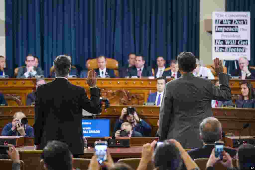 Top U.S. diplomat in Ukraine William Taylor, left, and Career Foreign Service officer George Kent are sworn before the House Intelligence Committee on Capitol Hill in Washington during the first public impeachment hearing of President Donald Trump.