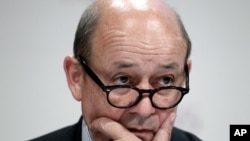 French Defense Minister Jean-Yves Le Drian listens to a speech at the Institute for Strategic Studies (IISS) Shangri-la Security Summit, in Singapore, June 3, 2012. 