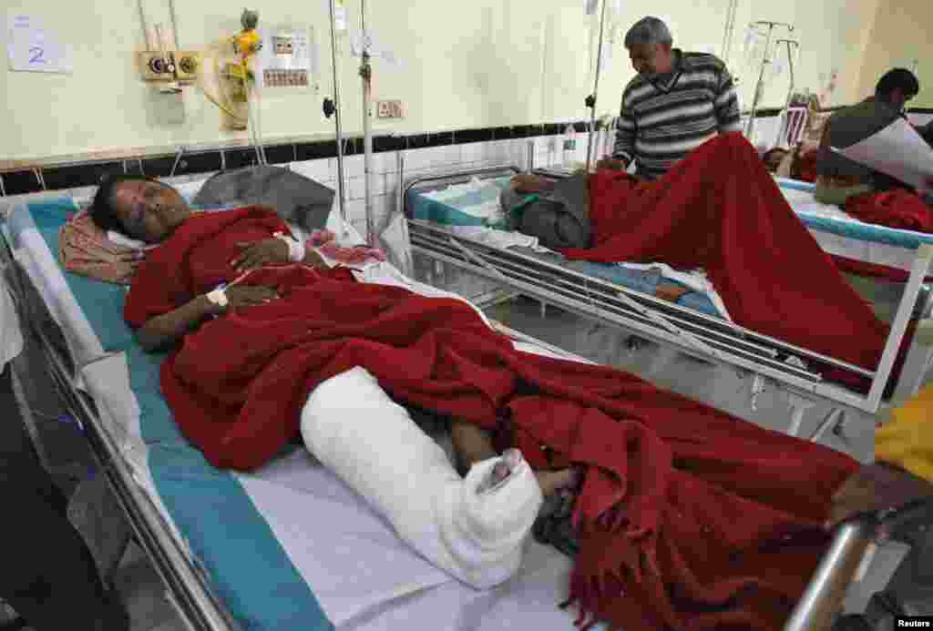 People who were injured in a stampede are treated inside a hospital in the northern Indian city of Allahabad, Feb. 11, 2013. 
