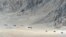 FILE - Indian soldiers walk at the foothills of a mountain range near Leh, the joint capital of the union territory of Ladakh, June 25, 2020.