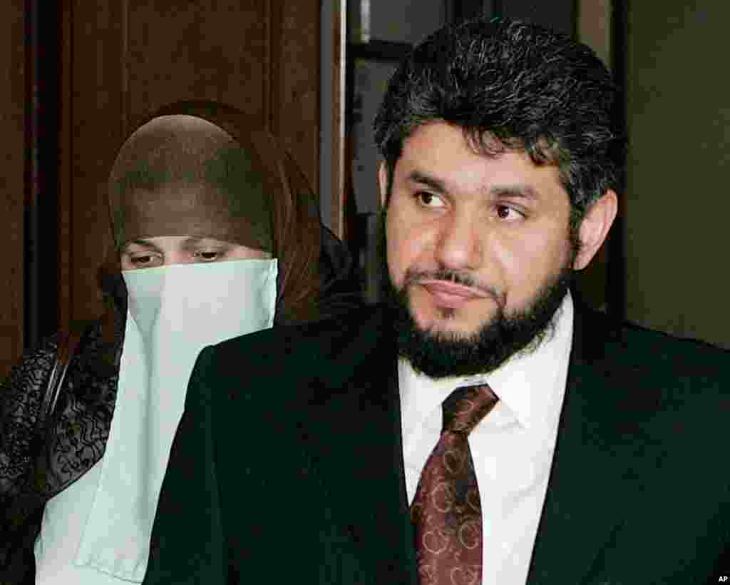 In this May 12, 2006 file photo, Sarah Khonaizan. left, and her husband Homaidan Al-Turki, both Saudi citizens, arrive at the Arapahoe County courthouse in Centennial, Colo. Homaidan al-Turki, a Saudi Arabian linguist, attended prayers at a mosque recorde