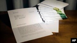 In this photo of a letter released by Vatican Media, retired Pope Benedict XVI praises a volume of books about the theological training of Pope Francis.