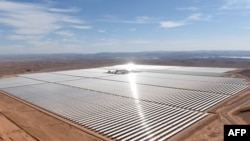 FILE —A picture taken on February 4, 2016 shows an aerial view of the solar mirrors at the Noor 1 Concentrated Solar Power (CSP) plant, some 20Km (12.5 miles) outside the central Moroccan town of Ouarzazate, ahead of its inauguration.