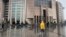 FILE - People walk outside the Justice Palace, in Istanbul, Sept. 20, 2019. Two reporters for the U.S.-based Bloomberg news agency appeared in court on Friday accused of trying to undermine Turkey's economic stability with a story they wrote the year prior. 