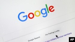 FILE - A cursor moves over Google's search engine page, in Portland, Oregon, Aug. 28, 2018. Google has taken a big step toward making passwords an afterthought by adding “passkeys” as a more straightforward and secure way to log into its services.
