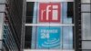 FILE - The headquarters of French national audiovisual media company group France Medias Monde (FMM), displays signage for Radio France Internationale (RFI) and France 24, in Issy-les-Moulineaux, near Paris, April 9, 2019.